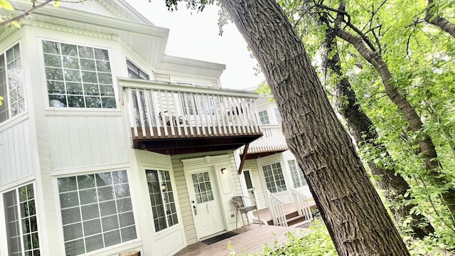 rear view of house featuring a balcony