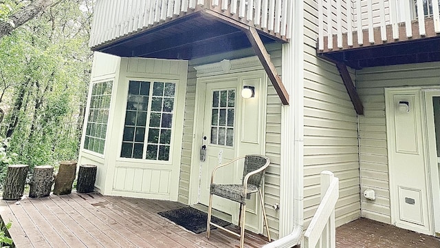 view of exterior entry with a deck