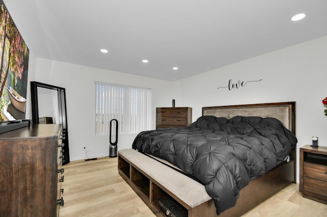 bedroom featuring light wood-type flooring and multiple windows