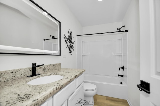 full bathroom with wood-type flooring, vanity, toilet, and shower / tub combination