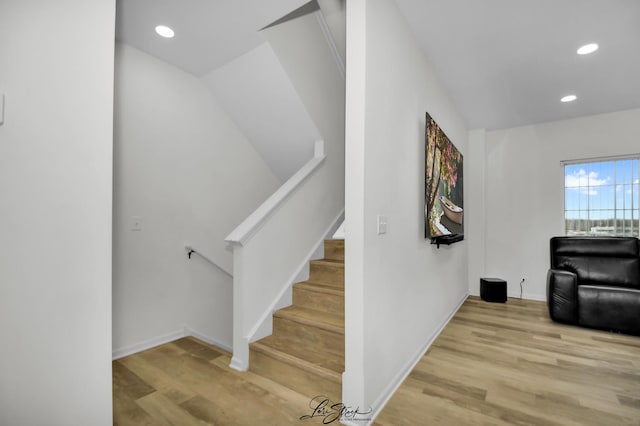 stairs with wood-type flooring