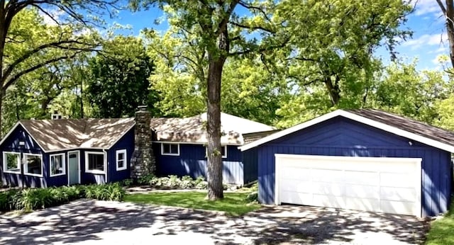 single story home featuring a garage