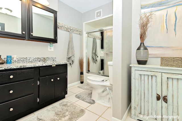 full bathroom featuring tile patterned flooring, vanity, toilet, and bath / shower combo with glass door