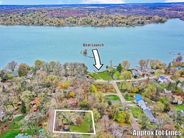 birds eye view of property featuring a water view