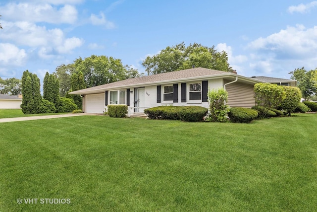 ranch-style home featuring a front lawn and a garage