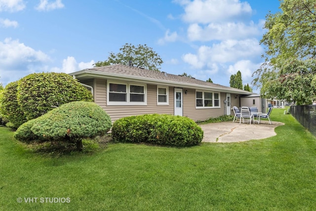 view of front of property with a patio area and a front yard