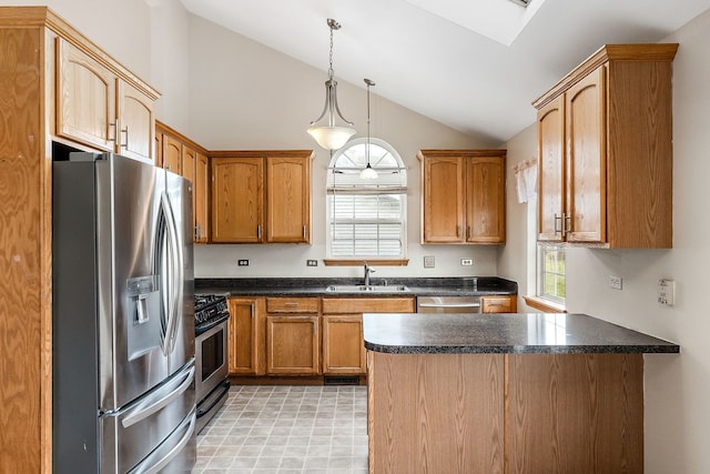 kitchen featuring decorative light fixtures, sink, stainless steel appliances, and lofted ceiling