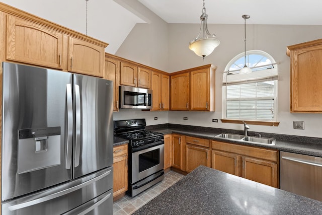 kitchen with stainless steel appliances, ceiling fan, sink, decorative light fixtures, and high vaulted ceiling