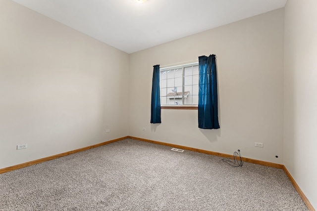 unfurnished room featuring carpet