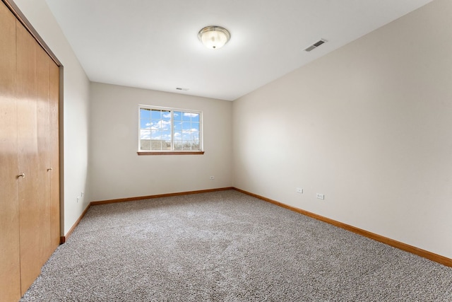 unfurnished bedroom featuring a closet and carpet