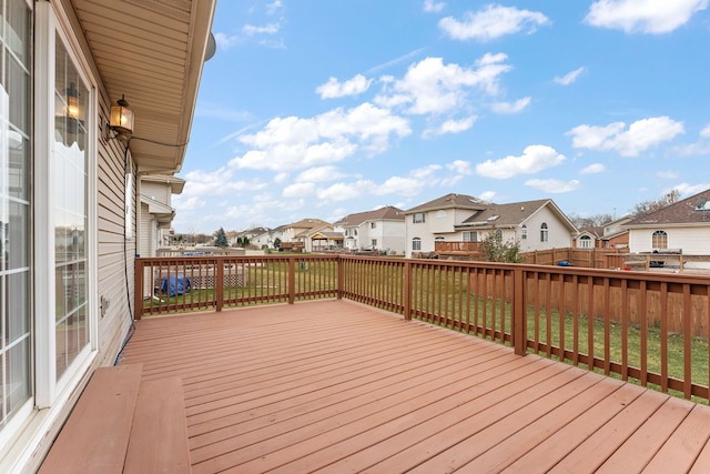 wooden terrace with a yard