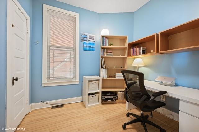 home office featuring visible vents, baseboards, and light wood-type flooring