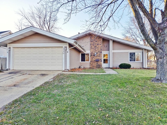 single story home with a front lawn and a garage