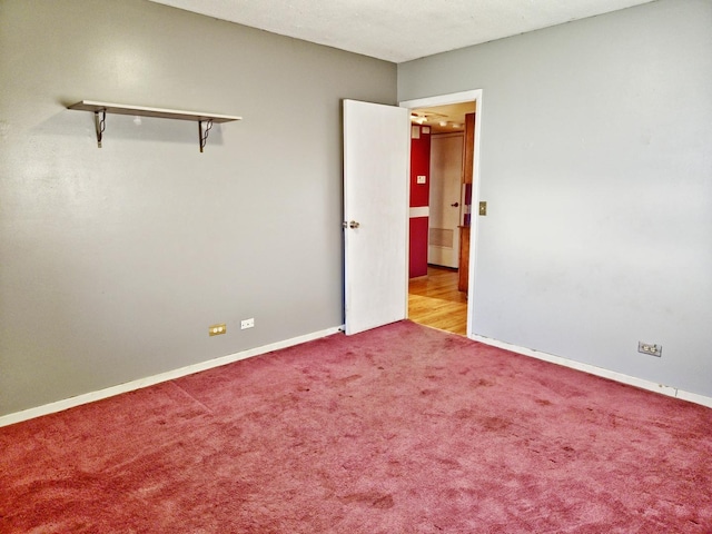 unfurnished room featuring light colored carpet