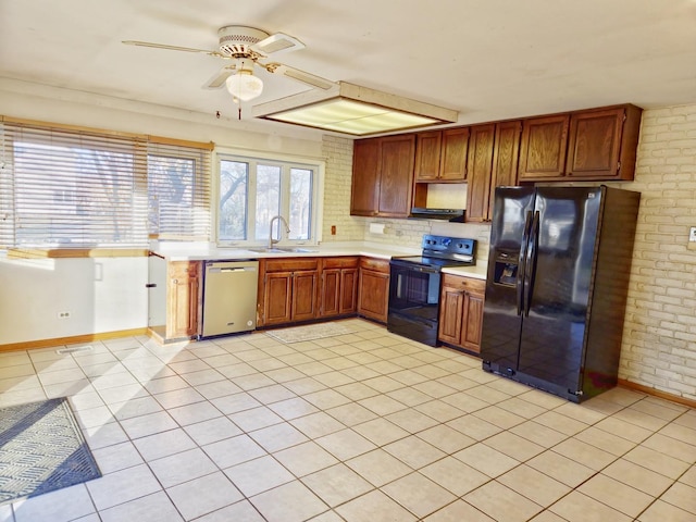 kitchen with brick wall, sink, electric range, fridge with ice dispenser, and dishwasher