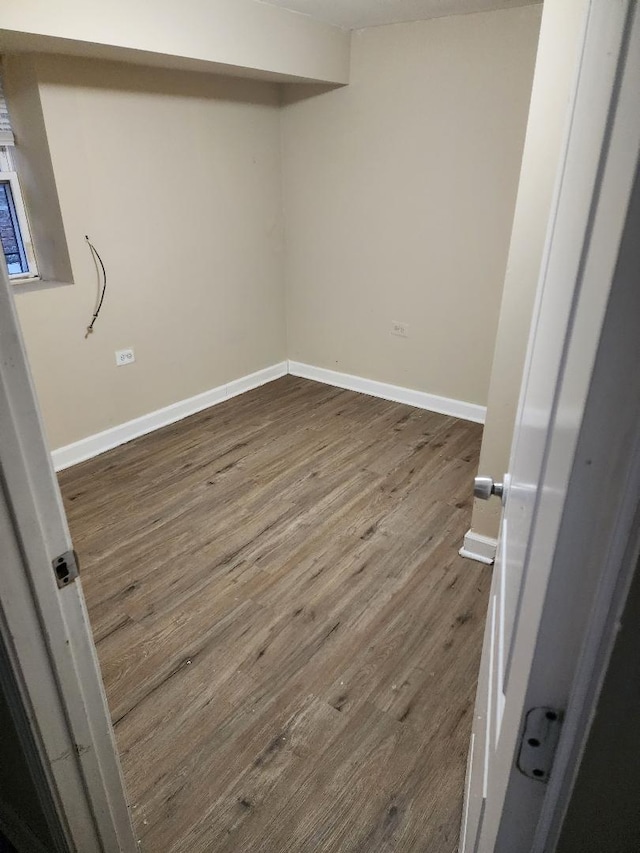 laundry area featuring hardwood / wood-style flooring