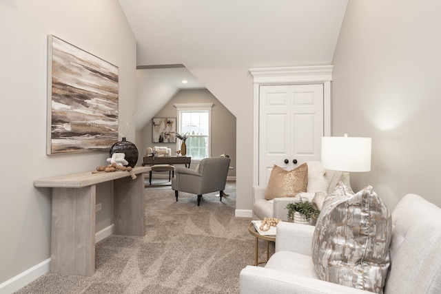 living area with light carpet and vaulted ceiling