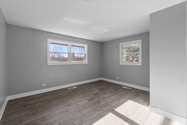 unfurnished room featuring wood-type flooring