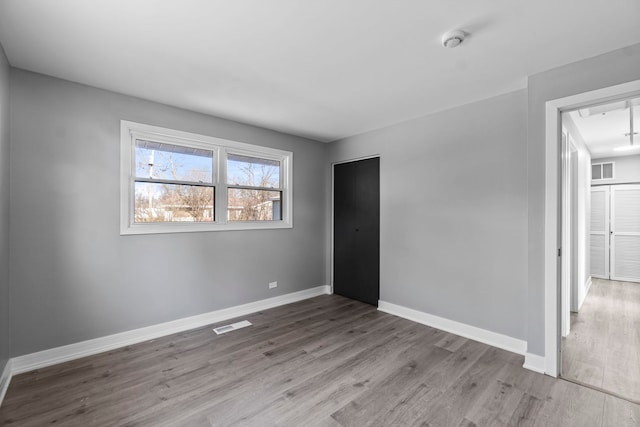 unfurnished room featuring light hardwood / wood-style floors