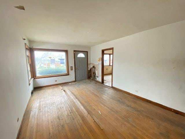 interior space featuring light wood-type flooring and plenty of natural light