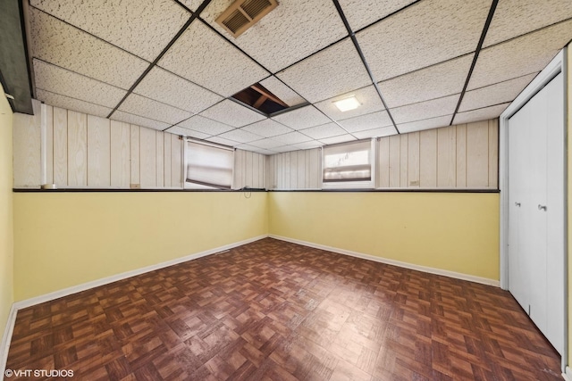 basement with dark parquet floors