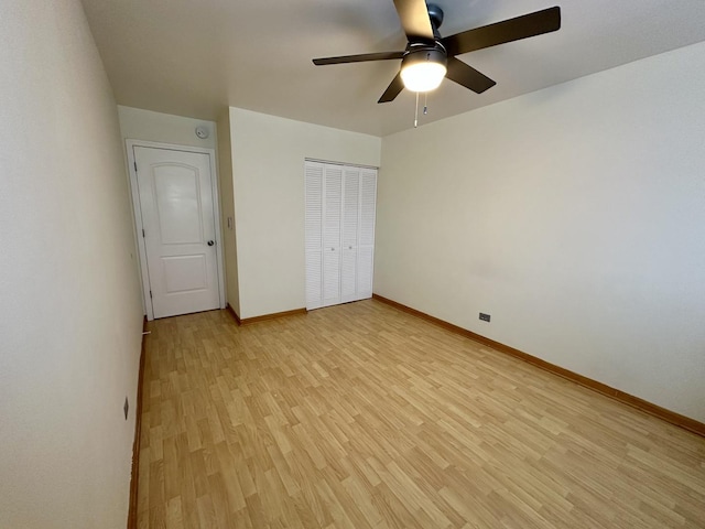 unfurnished bedroom with a closet, ceiling fan, and light hardwood / wood-style flooring