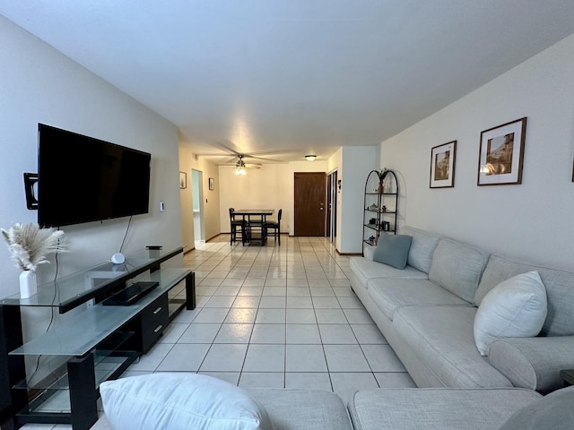 living room with ceiling fan and light tile patterned floors