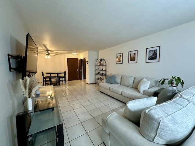 tiled living room with ceiling fan