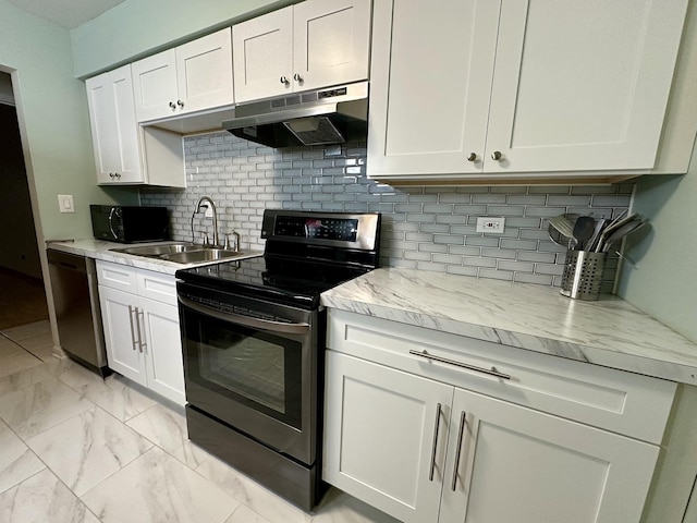 kitchen featuring sink, decorative backsplash, light stone counters, white cabinetry, and stainless steel appliances