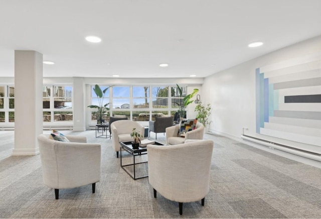 carpeted living room with a baseboard radiator