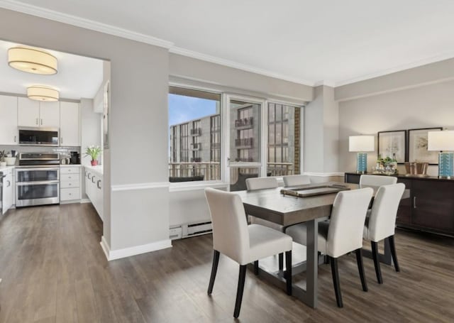 dining area with ornamental molding, dark wood-type flooring, and a baseboard heating unit