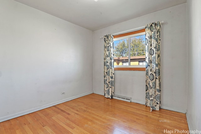 empty room featuring hardwood / wood-style floors