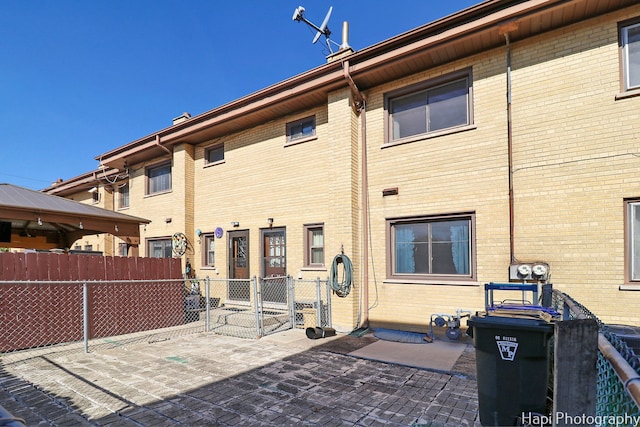 back of house with a patio