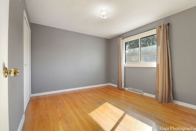 spare room featuring hardwood / wood-style floors