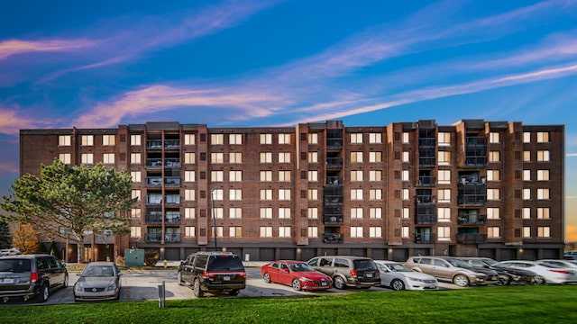 view of outdoor building at dusk