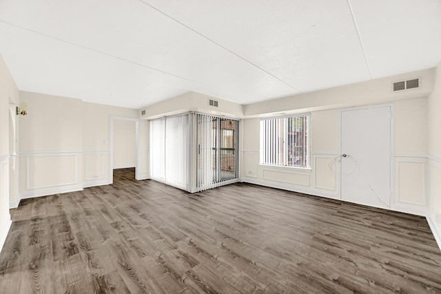 bonus room with dark wood-type flooring