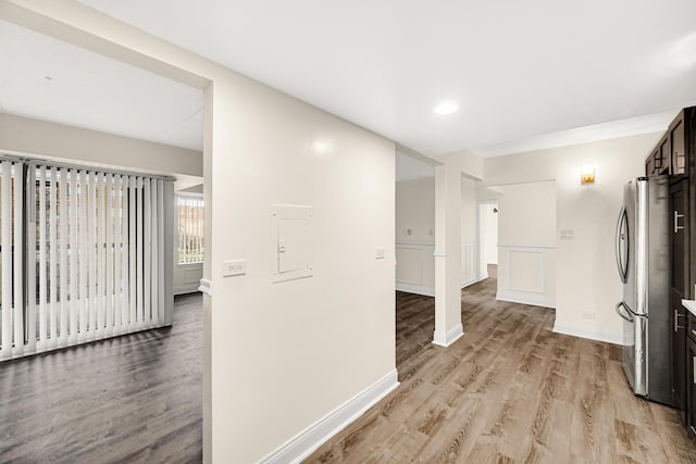 corridor with light wood-type flooring