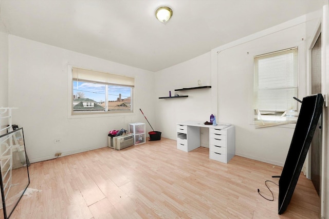 office area with light hardwood / wood-style floors