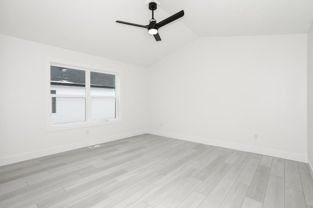 unfurnished room featuring ceiling fan, light wood-type flooring, and lofted ceiling