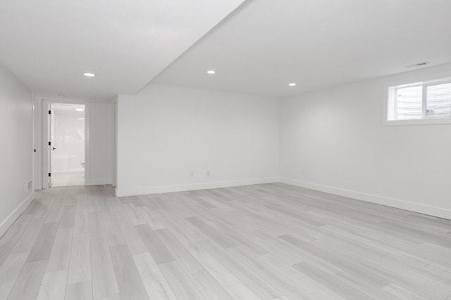 spare room featuring light wood-type flooring