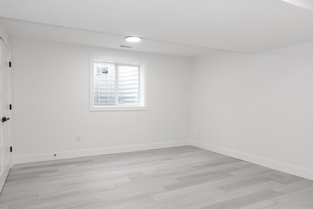 unfurnished room featuring light hardwood / wood-style flooring