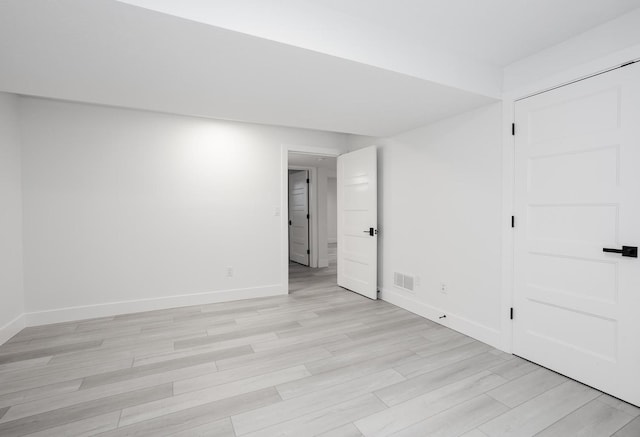 unfurnished room featuring light hardwood / wood-style floors