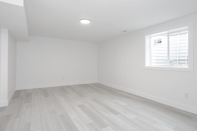 spare room with light hardwood / wood-style floors