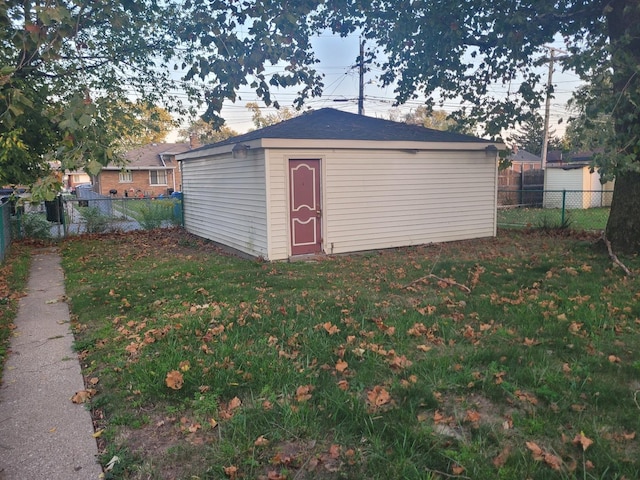 view of outdoor structure with a lawn