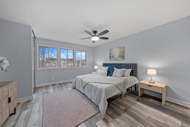 bedroom featuring hardwood / wood-style flooring and ceiling fan