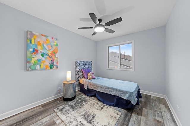 bedroom with hardwood / wood-style flooring and ceiling fan