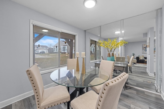 dining area with hardwood / wood-style flooring