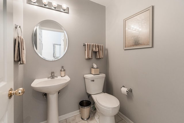 bathroom with tile patterned flooring and toilet