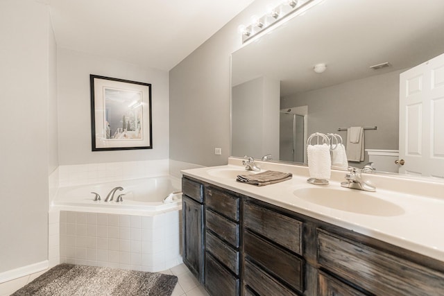 bathroom with tile patterned floors, plus walk in shower, and vanity