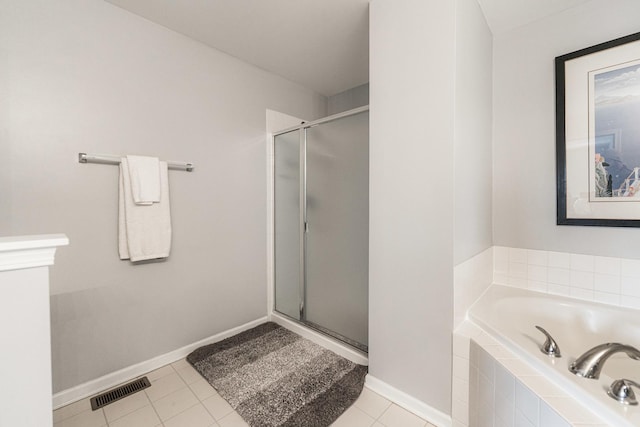 bathroom featuring tile patterned flooring and plus walk in shower